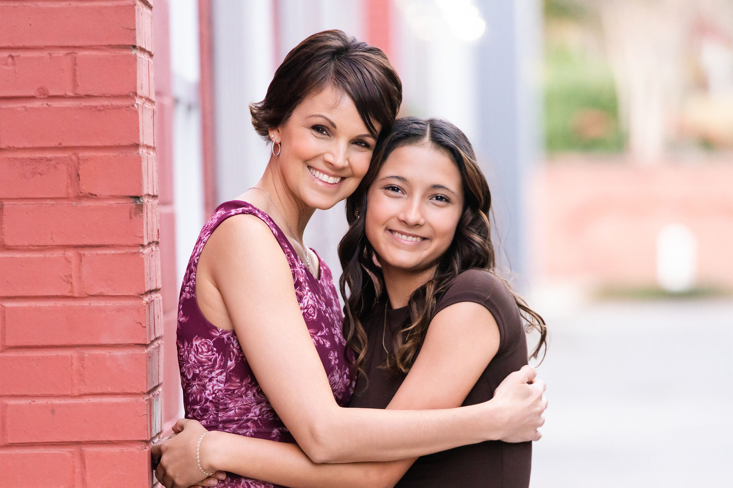 Mother and daughter smiling together outdoors, symbolizing their clean living journey after a cancer diagnosis. Soft natural light, warm tones, healthy lifestyle theme.